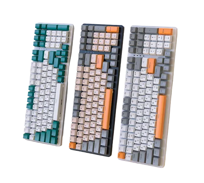 Three colorful mechanical keyboards in teal, gray, and white, featuring stylish keycap designs.