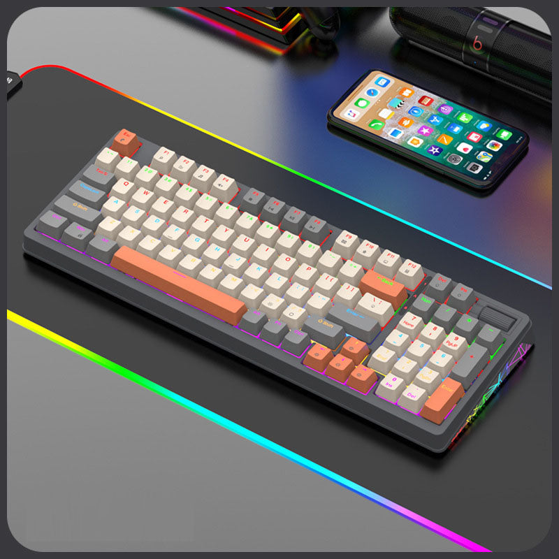 Colorful mechanical keyboard with RGB lighting and orange accents, ideal for gaming and typing.